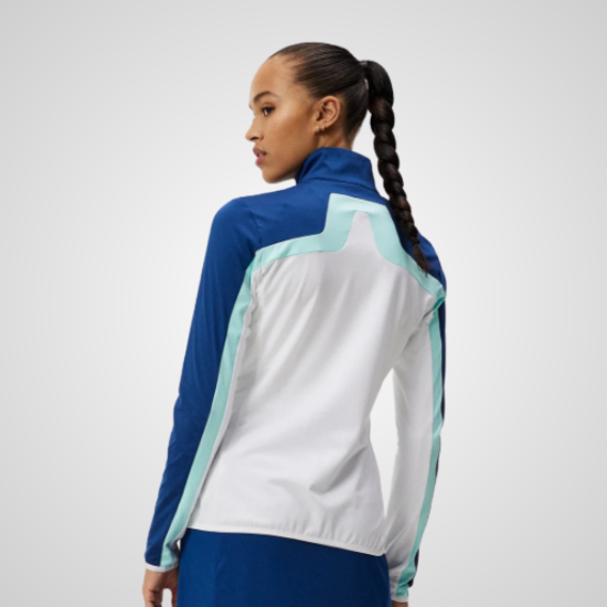 Model wearing J.Lindeberg Ladies Janice White Golf Midlayer Back View