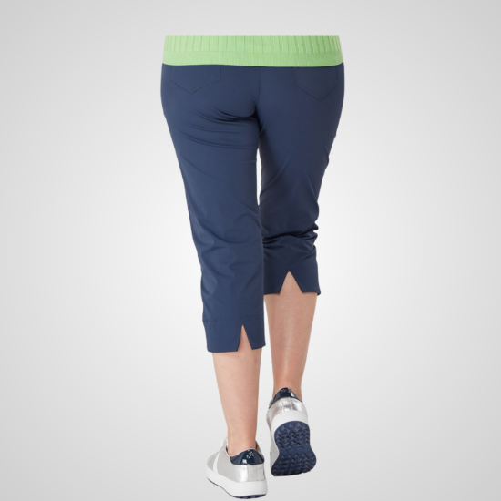 Model wearing Swing Out Sister Ladies Core Navy Golf Capri Trousers Back View