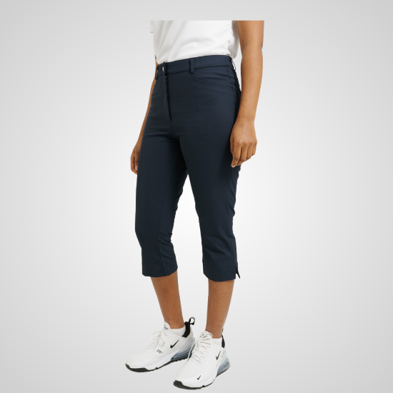 Model wearing Abacus Ladies Elite 4-Way Stretch Navy Golf Capri Front View