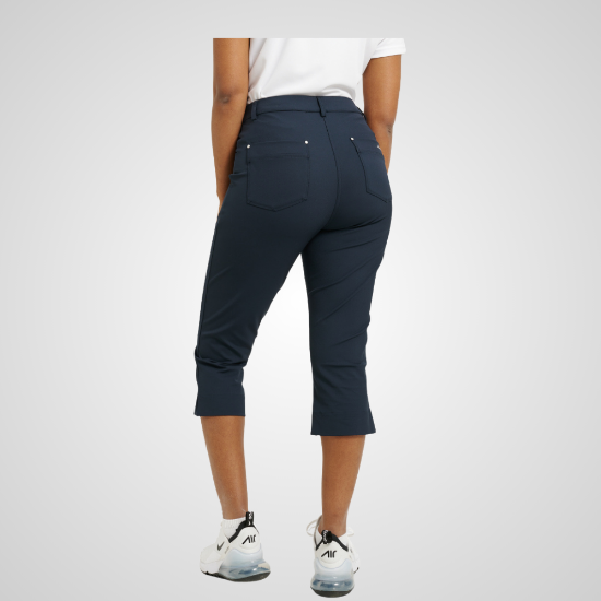 Model wearing Abacus Ladies Elite 4-Way Stretch Navy Golf Capri Back View