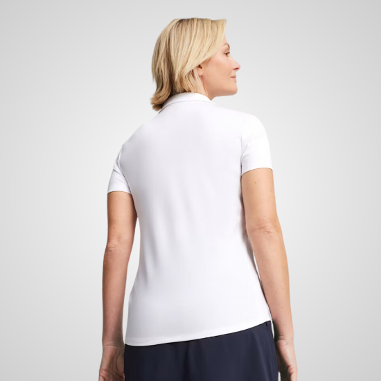 Model wearing Puma Ladies Pure White Golf Polo Shirt Back View