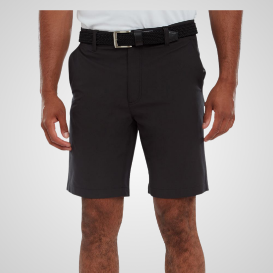 Model wearing FootJoy Men's Par Black Golf Shorts Front View