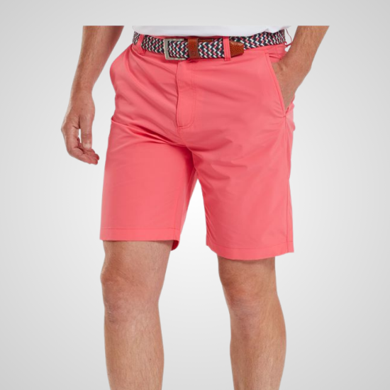 Model wearing FootJoy Men's Par Coral Red Golf Shorts Front View