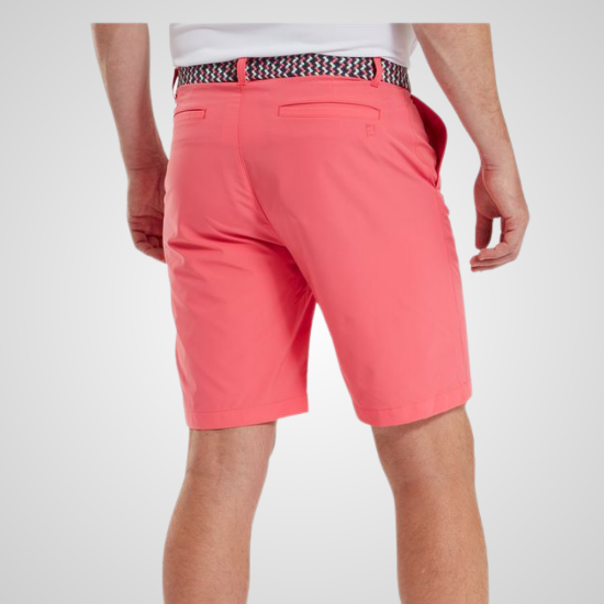 Model wearing FootJoy Men's Par Coral Red Golf Shorts Back View
