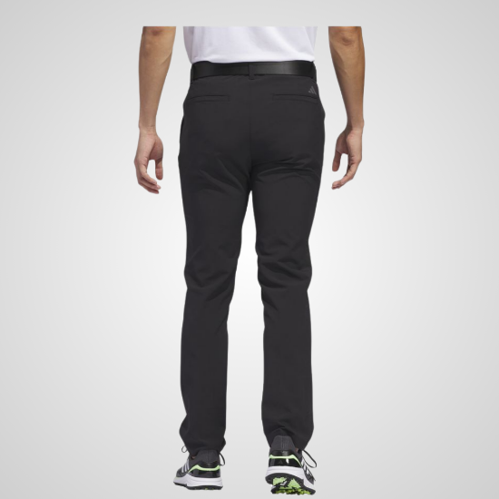 Model wearing adidas Men's Ultimate 365 Tapered Black Golf Pants Back View