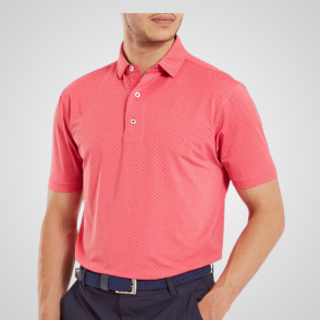 Model wearing FootJoy Men's Stretch Lisle Dot Print Coral Red Golf Polo Shirt Front View