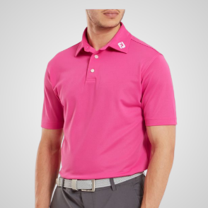 Model wearing FootJoy Men's Stretch Pique Solid Hot Pink Golf Polo Shirt Front View