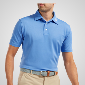 Model wearing FootJoy Men's Stretch Pique Solid Light Blue Golf Polo Shirt Front View
