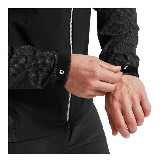 Model wearing FootJoy Men's HydroTour Golf Rain Jacket in Black Sleeve Detail