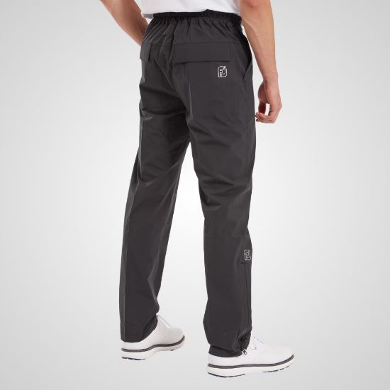 Model wearing FootJoy Men's HydroLite X Golf Rain Trousers Black Rear View