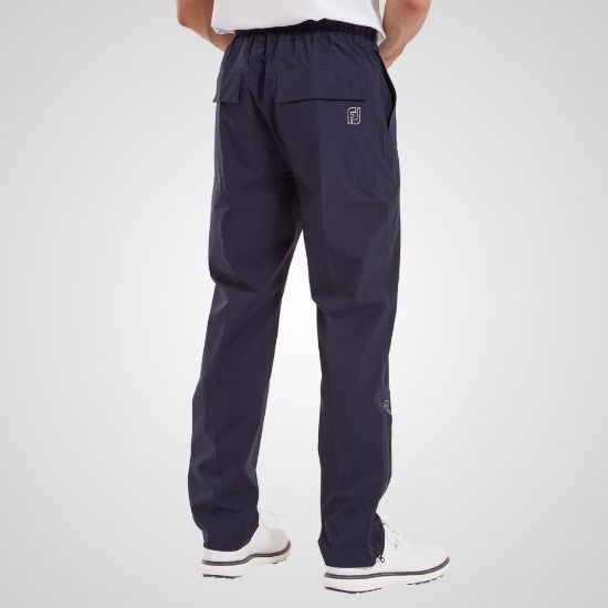 Model wearing FootJoy Men's HydroLite X Golf Rain Trousers Navy Rear View